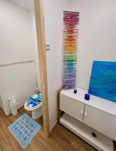 a small bathroom with a toilet and a window at Domaine d'Equital'Or in Cressanges +34 photos
