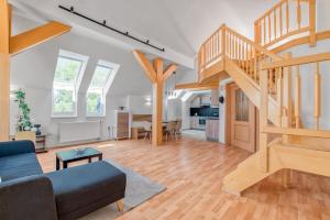 a living room with a staircase and a living room at Apartmány Nerudova in Vítkovice