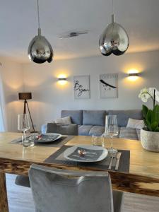 a living room with a table and a couch at Moselmoni in Bullay
