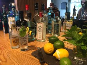 a table with bottles of alcohol and lemons on it at The Craven Arms in Settle