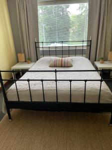a bed sitting in a bedroom with a window at Yyterin Meriheinä in Pori +39 photos
