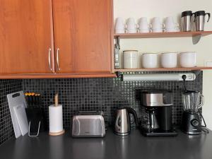 a kitchen counter with appliances on a counter top at Yyterin Meriheinä in Pori