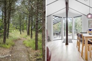 a house in the woods with a view of a forest at LF581-Hurup-Thy-Haettemagevej-1 in Sindrup +18 photos