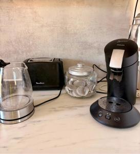a kitchen counter with a blender and a toaster at Domaine d'Equital'Or in Cressanges