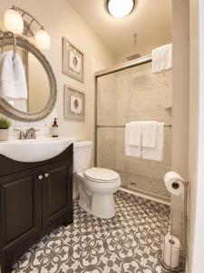 a bathroom with a sink and a toilet and a shower at Bellevue House in Newport