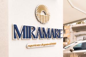 a sign for a mercedes benz car dealership at Hotel Miramare in Porto Cesareo +12 photos