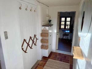 a hallway of a home with a door and a stairway at LF11124-Struer-Vesterkaervej-24 in Struer +33 photos