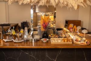 a counter with many different types of food on it at Artsy Cascais in Cascais