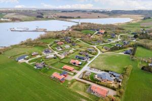 an aerial view of a village next to a lake at LF544-Hurup-Thy-Skraningen-3 in Doverodde +18 photos