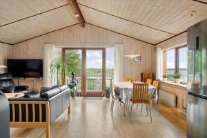 a living room with a table and a couch at LF483-Snedsted-Bjergvej-8 in Snedsted
