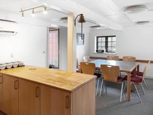 an empty room with a table and chairs in it at 0397-Romo-Engvej-40 in Høm