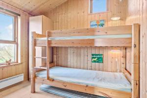 a bedroom with two bunk beds in a cabin at LF241-Snedsted-Kongens-Borer-10 in Snedsted