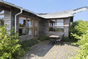 a house with a table and chairs in front of it at LF241-Snedsted-Kongens-Borer-10 in Snedsted +20 photos