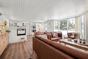 a living room with a couch and a table at LF16240-Logstor-Mollysvej-10 in Løgstør