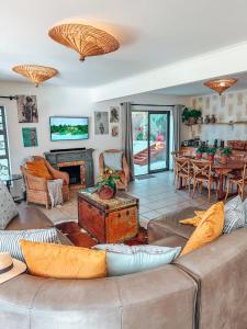a living room with a couch and a table at Buff and Fellow by the Bay in Great Brak River