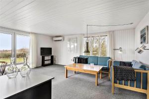 a living room with a couch and a table at LF593-Vestervig-Ingeborgs-Alle-21 in Vestervig
