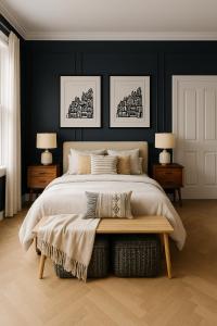 a bedroom with a large bed and two lamps at The Bridge York in York +7 photos