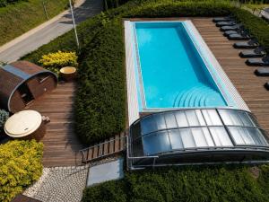 an overhead view of a swimming pool on a wooden deck at Hotel Bardo in Bardo
