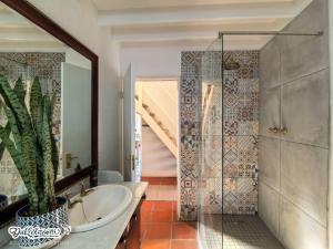 a bathroom with a tub and a sink and a mirror at Critchley Common in Dullstroom +44 photos