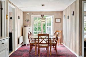 a dining room with a table and chairs at LF16103-Farso-Kjeldhoj-103 in Farsø