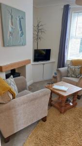a living room with a couch and a table at York city centre No7 Agar Street in York