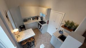 an overhead view of a kitchen with white cabinets at York city centre No7 Agar Street in York