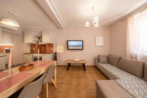 a living room with a couch and a table at Traditional House in Mytilene Center in Mytilene