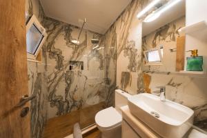 a bathroom with a sink and a toilet at Traditional House in Mytilene Center in Mytilene +46 photos