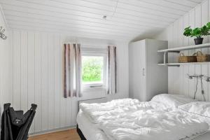 a white bedroom with a bed and a window at LF634-Vestervig-Gunhildsvej-54 in Vestervig +22 photos