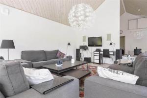 a living room with two couches and a tv at 13328-Vig-Lillemosevej-5 in Vig