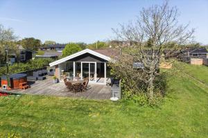 a backyard with a wooden deck with a gazebo at LF320-Hurup-Thy-Skraningen-9 in Doverodde