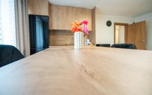 a vase of flowers sitting on top of a table at Apartman Lili in Knin