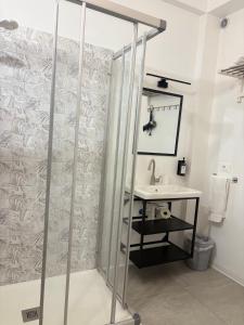 a bathroom with a shower and a sink at Alla Pergola in Ceniga +15 photos