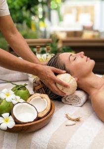 a woman getting a massage at a spa at Hotel Sant'Andrea in Santa Margherita Ligure