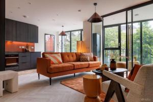 a living room with a couch and a table at Apex Executive Apartments - The Ironworks in Dublin