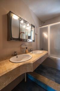 two sinks in a bathroom with two mirrors at Javea Vedat by Concept Flats in Jávea +13 photos