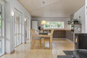 a kitchen with a table and chairs in a room at LF229-Vestervig-Hannesvej-16 in Vestervig