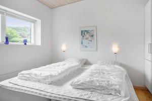 a white bedroom with a large bed with white sheets at LF229-Vestervig-Hannesvej-16 in Vestervig
