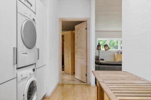 a kitchen with a washer and dryer in a room at LF229-Vestervig-Hannesvej-16 in Vestervig