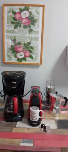 a kitchen counter with a coffee maker and a coffee mug at Villa Leena in Paramonas