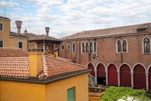 a group of brick buildings with red roofs at Rialto Charm Boutique in Venice