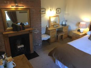 A bed or beds in a room at Willow Tree House 