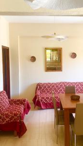 a room with a bed and a table with a laptop at TETRAKTYS ESTATE beachside seaview ΥΔΩΡ with big garden in Halikounas