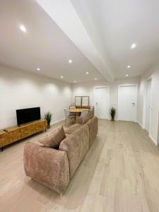 a living room with a couch and a table at Vila Sotto Mayor in Figueira da Foz