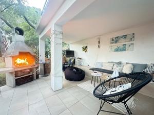 a living room with a couch and a fireplace at Apartment Kordić in Sveta Nedelja