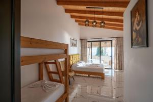 two bunk beds in a room with a balcony at Hotel Panorama Piqeras in Piqeras +182 photos