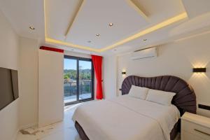 a bedroom with a bed and a large window at Villa Prestige 2 in Fethiye +54 photos