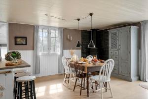 a kitchen and dining room with a table and chairs at LF391-Vestervig-Gunhildsvej-1 in Vestervig