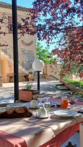 a table with plates of food on top at La Vecchia Fontana in Penne