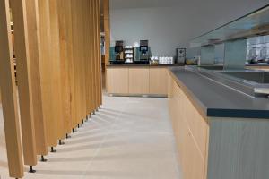 a kitchen with wooden cabinets and a counter top at Hotel Spenerhaus - neu und vollklimatisiert in allen Zimmern in Frankfurt